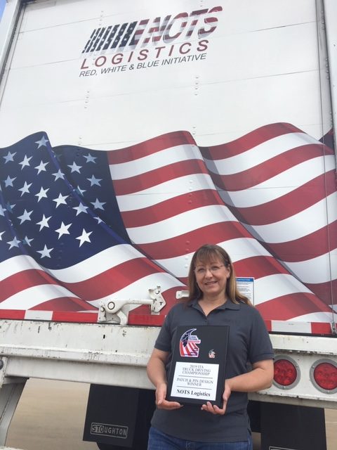 woman posing with the 2019 ITA plaque she won