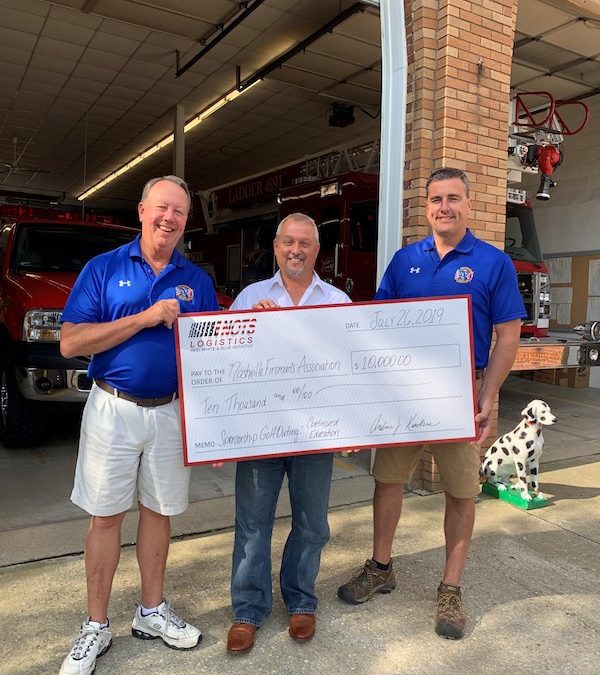 andy kirchner delivering check to the Nashville Fireman's Association