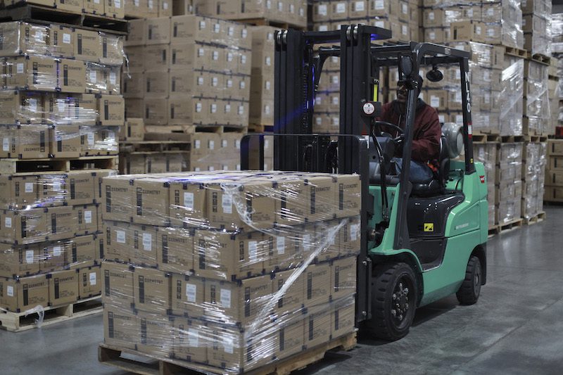 green forklift in warehouse