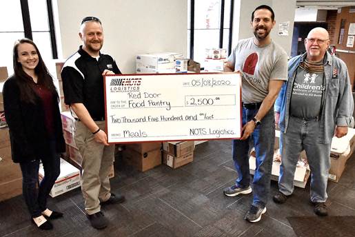 Holding check Red Door Food Pantry